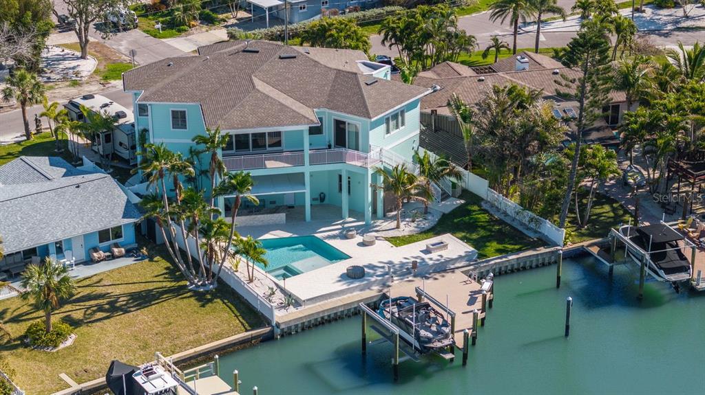 15904 Redington Drive Redington Beach, FL 33708 - Photo 1 of 1 an aerial view of houses with deck