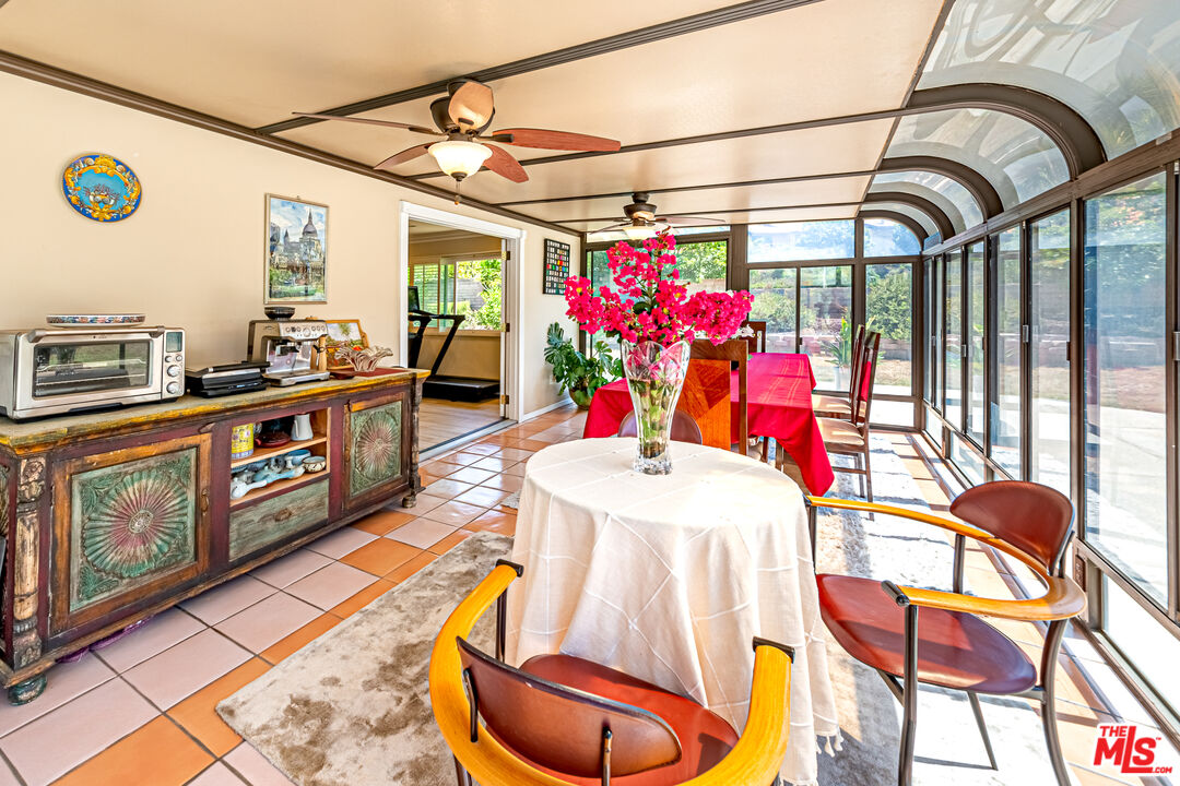 1195 Vía Pintada Riverside, CA 92507 - Photo 11 of 51 a view of a dining room with furniture wooden floor and a rug