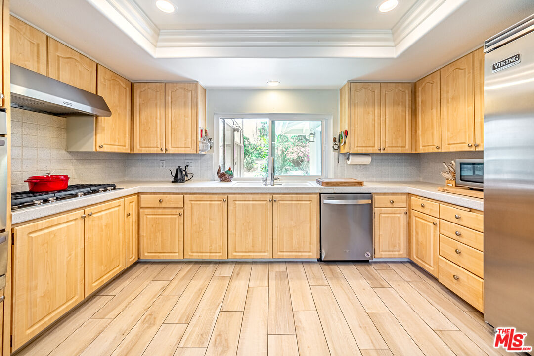 1195 Vía Pintada Riverside, CA 92507 - Photo 15 of 51 a kitchen with a sink wooden floor and window