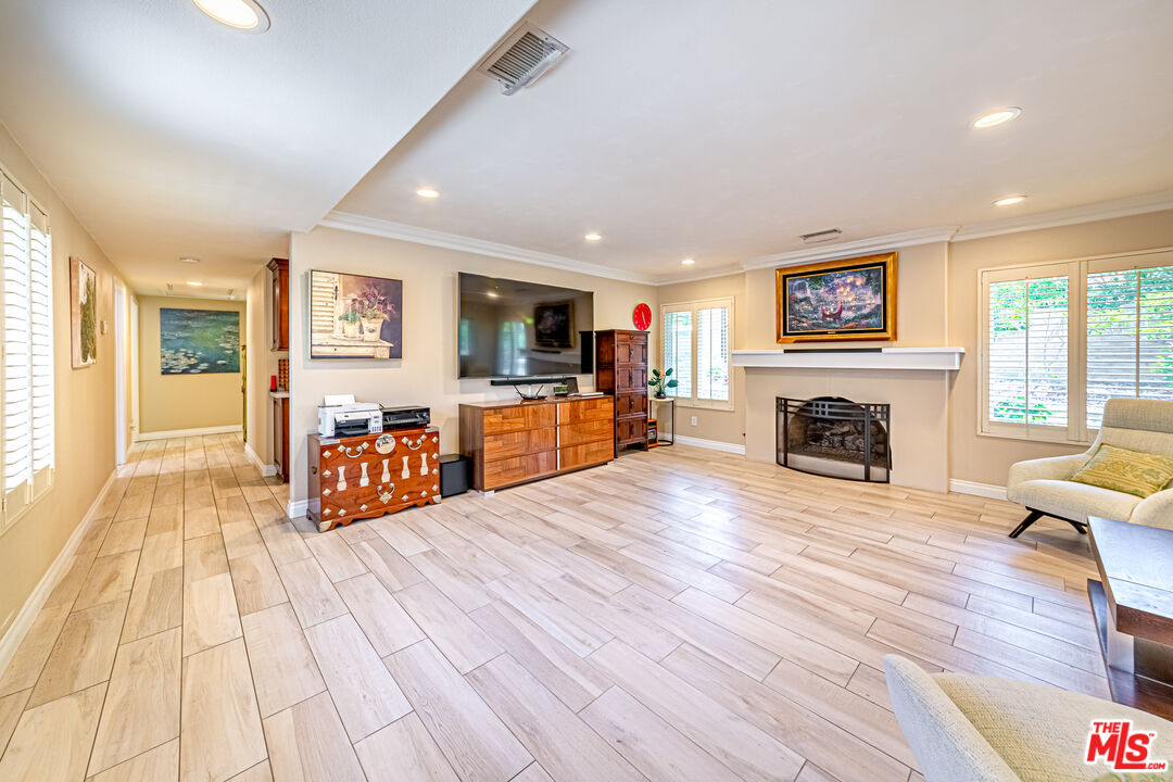 1195 Vía Pintada Riverside, CA 92507 - Photo 16 of 51 a living room with furniture and a fireplace