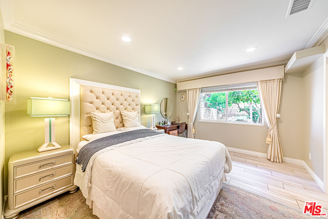 1195 Vía Pintada Riverside, CA 92507 - Photo 19 of 51 a large bed sitting in a bedroom next to a window