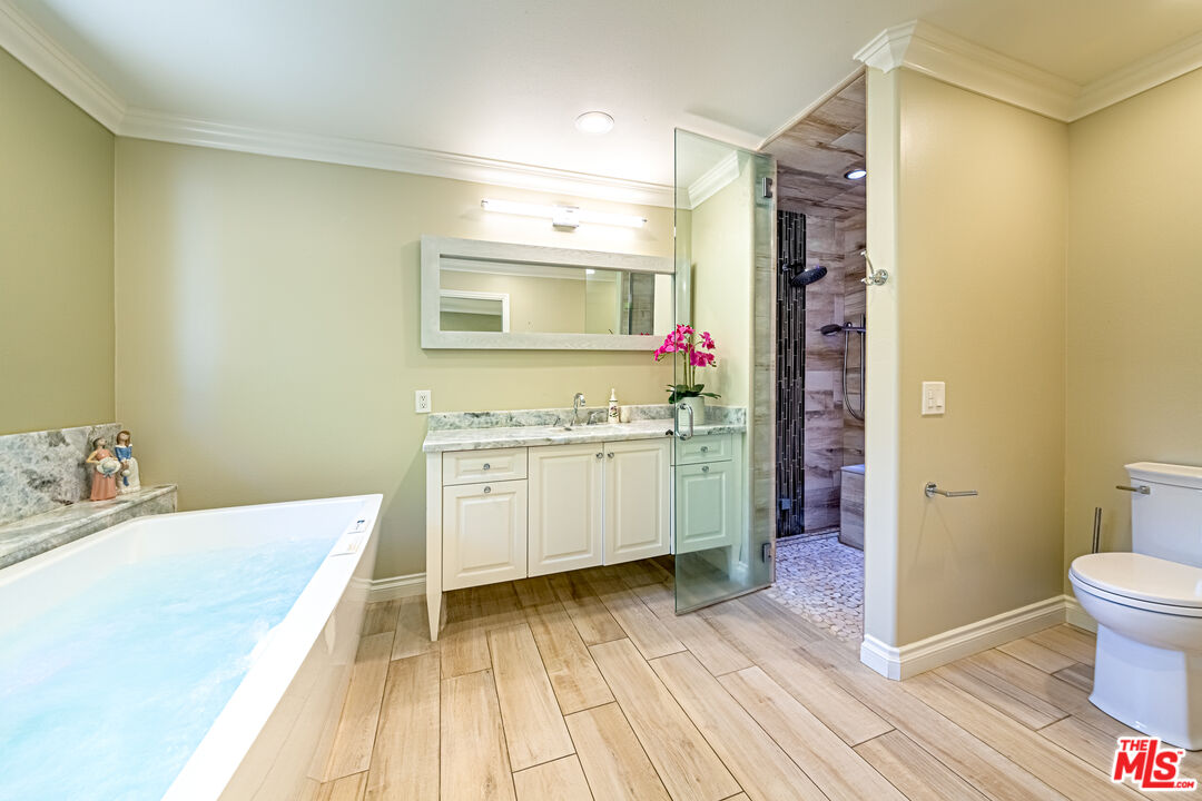 1195 Vía Pintada Riverside, CA 92507 - Photo 22 of 51 a bathroom with a sink and a mirror