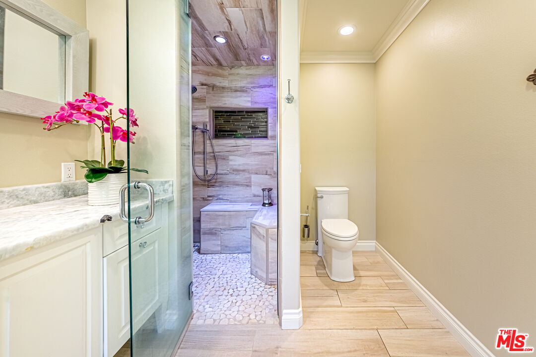 1195 Vía Pintada Riverside, CA 92507 - Photo 24 of 51 a bathroom with a sink and a mirror