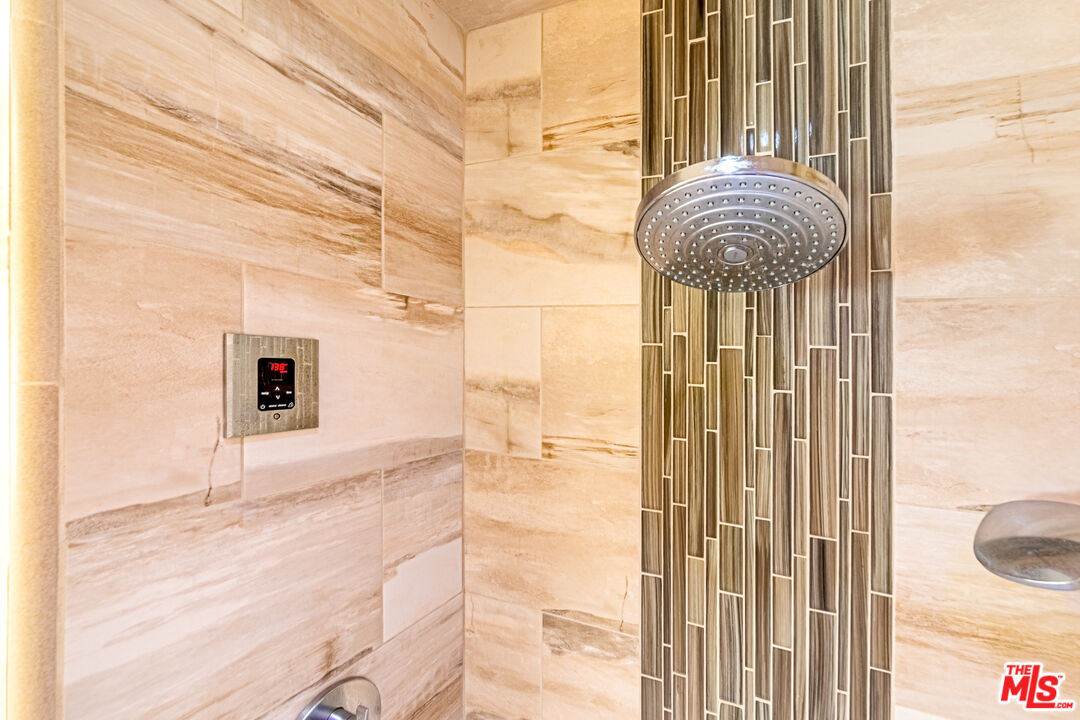 1195 Vía Pintada Riverside, CA 92507 - Photo 26 of 51 a bathroom with a granite countertop shower and a sink