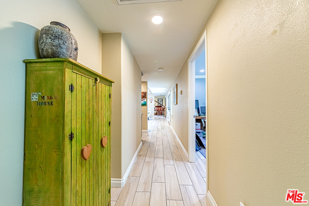 1195 Vía Pintada Riverside, CA 92507 - Photo 33 of 51 a view of a hallway with wooden floor