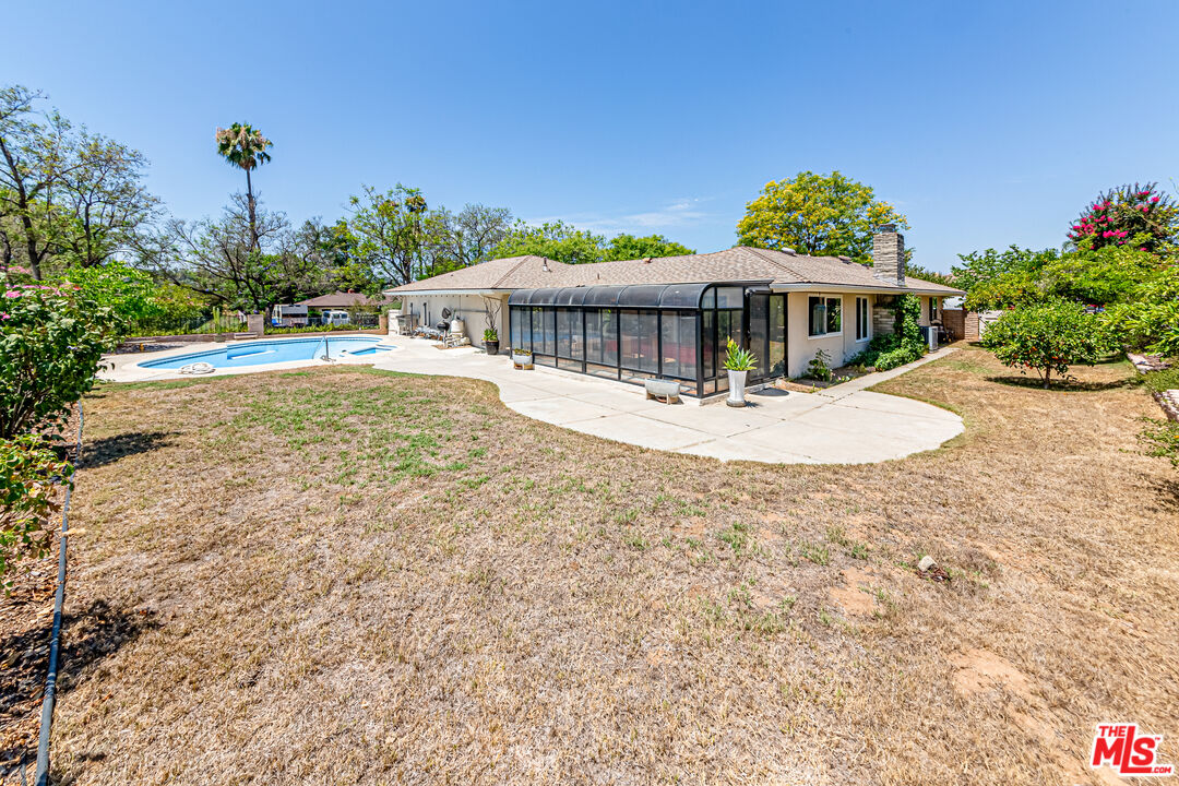 1195 Vía Pintada Riverside, CA 92507 - Photo 34 of 51 a view of a house with a yard and sitting area