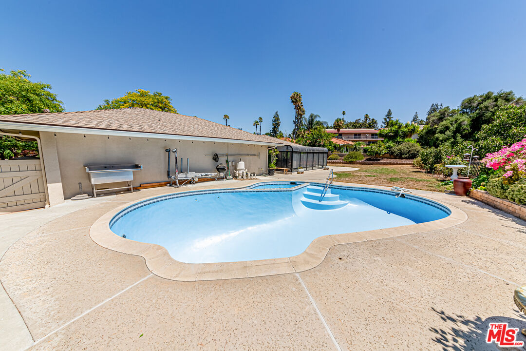 1195 Vía Pintada Riverside, CA 92507 - Photo 35 of 51 a view of a swimming pool with outdoor seating