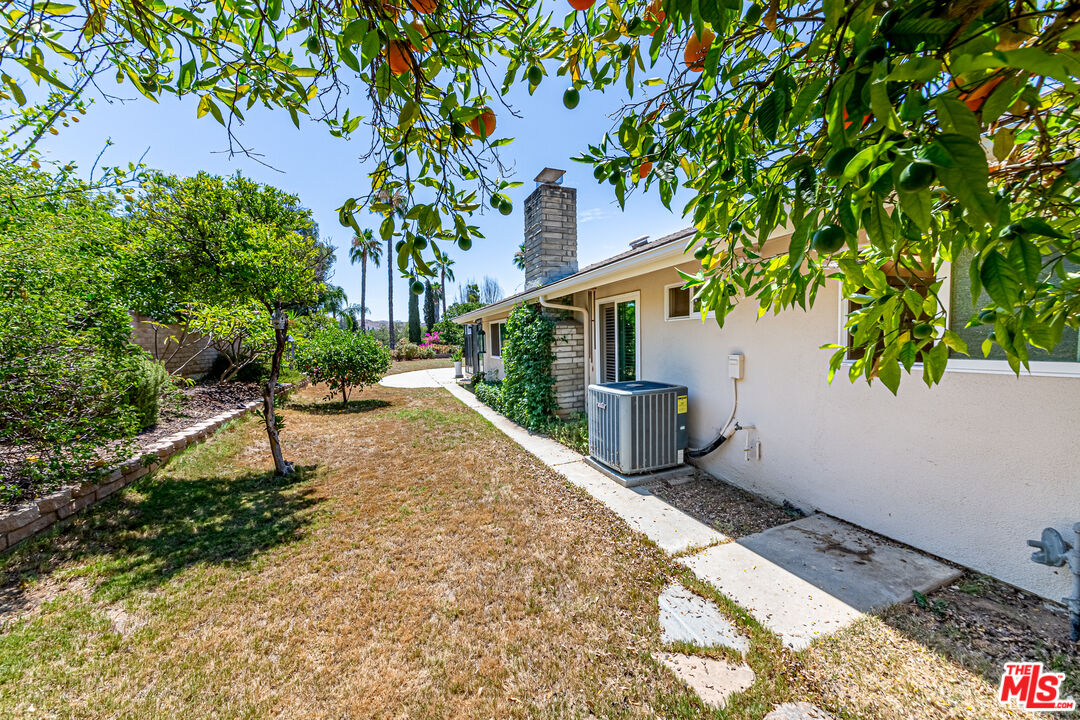 1195 Vía Pintada Riverside, CA 92507 - Photo 38 of 51 a white house with trees in front of it