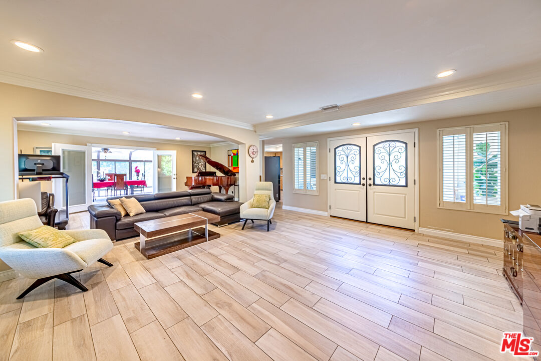 1195 Vía Pintada Riverside, CA 92507 - Photo 4 of 51 a living room with furniture and a wooden floor