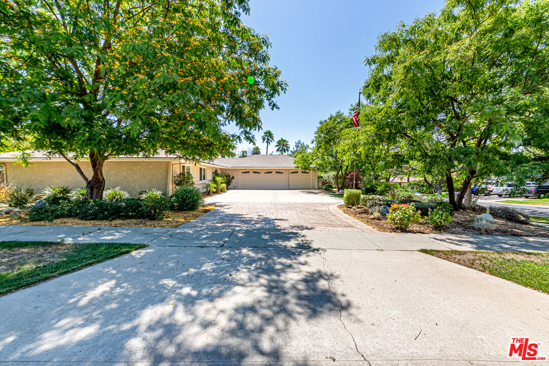 1195 Vía Pintada Riverside, CA 92507 - Photo 41 of 51 a view of a yard with plants and trees beside of road
