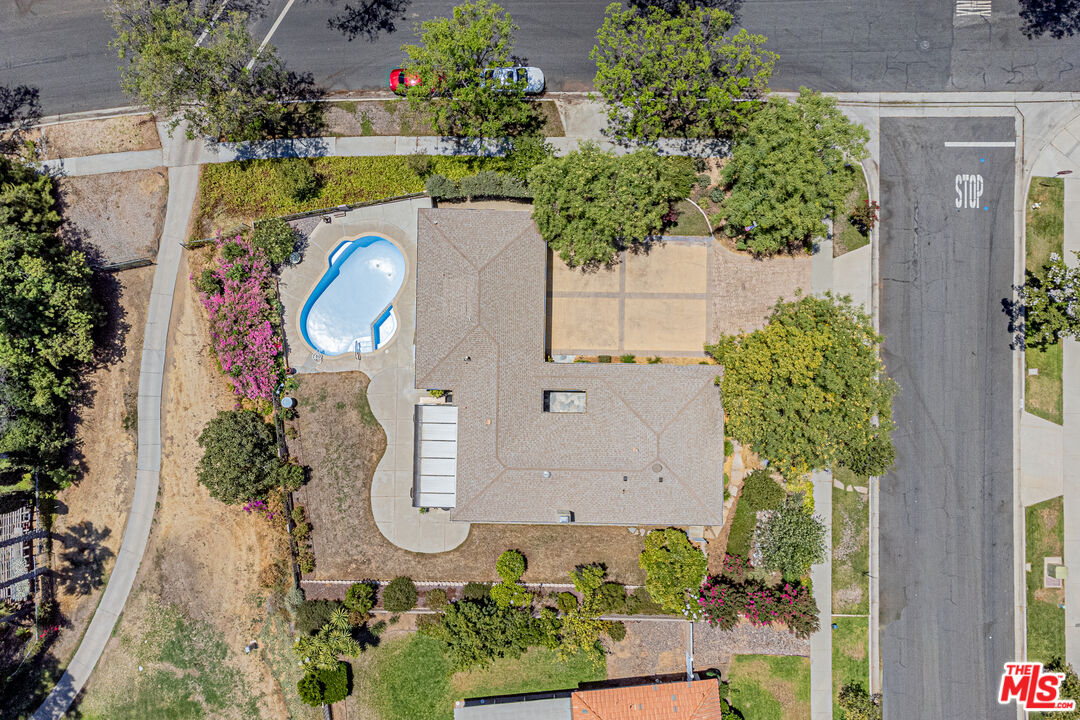 1195 Vía Pintada Riverside, CA 92507 - Photo 45 of 51 an aerial view of a house with a swimming pool