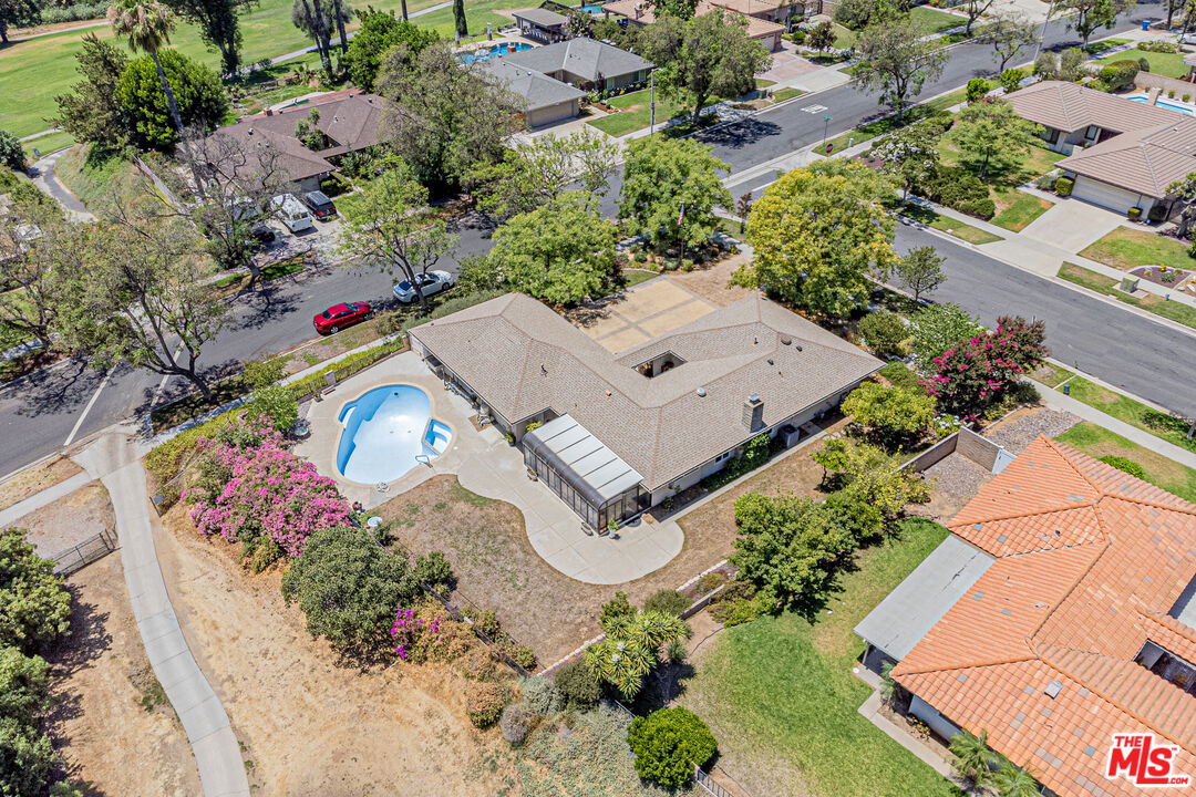 1195 Vía Pintada Riverside, CA 92507 - Photo 46 of 51 an aerial view of a house with a yard and garden