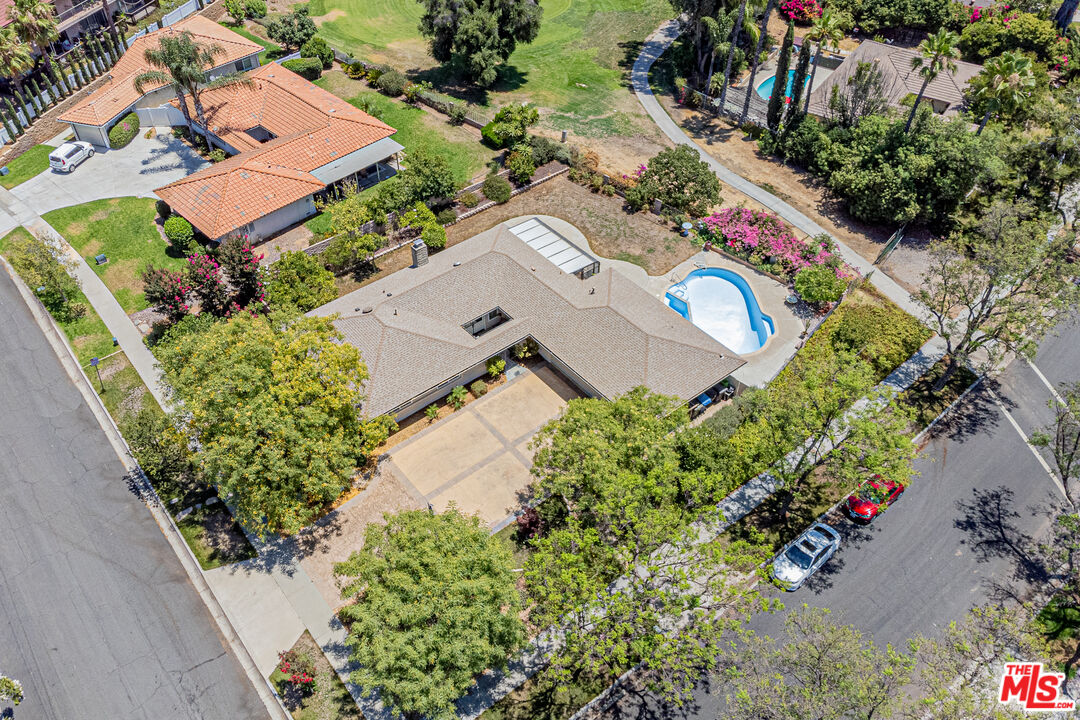 1195 Vía Pintada Riverside, CA 92507 - Photo 47 of 51 an aerial view of a house with a yard and garden