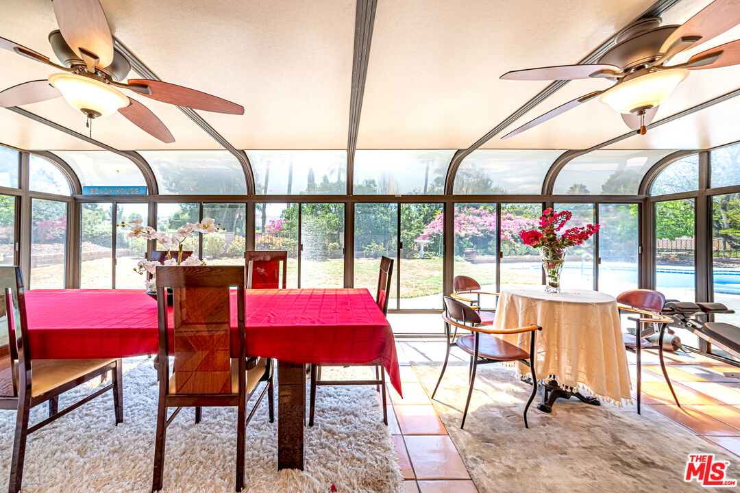 1195 Vía Pintada Riverside, CA 92507 - Photo 9 of 51 a view of a dining room with furniture a chandelier and wooden floor