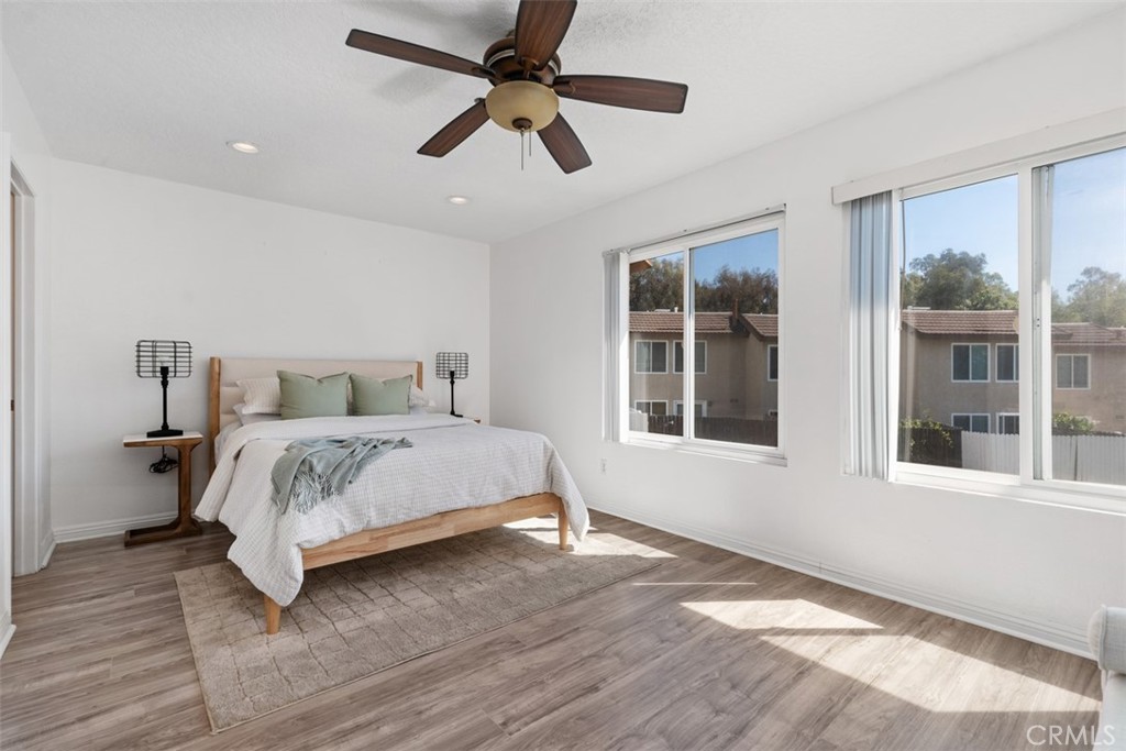 25885 Trabuco Road, Unit 203 Lake Forest, CA 92630 - Photo 16 of 43 a bedroom with a large bed and a large window