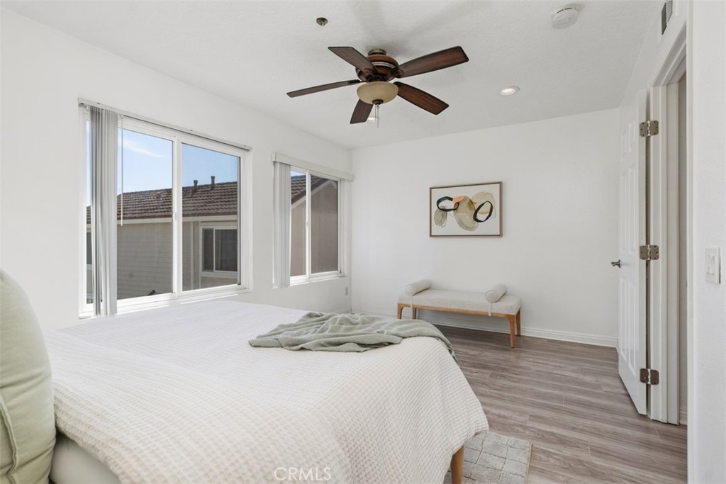 25885 Trabuco Road, Unit 203 Lake Forest, CA 92630 - Photo 17 of 43 a bedroom with a bed and a large window