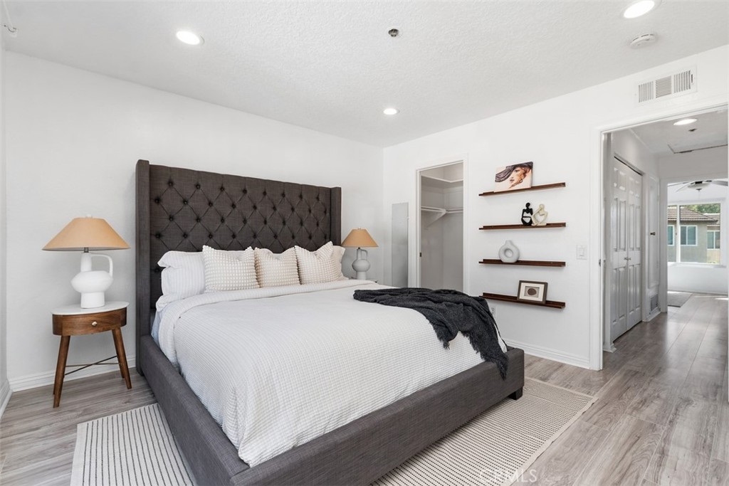 25885 Trabuco Road, Unit 203 Lake Forest, CA 92630 - Photo 19 of 43 a bedroom with bed and a lamp