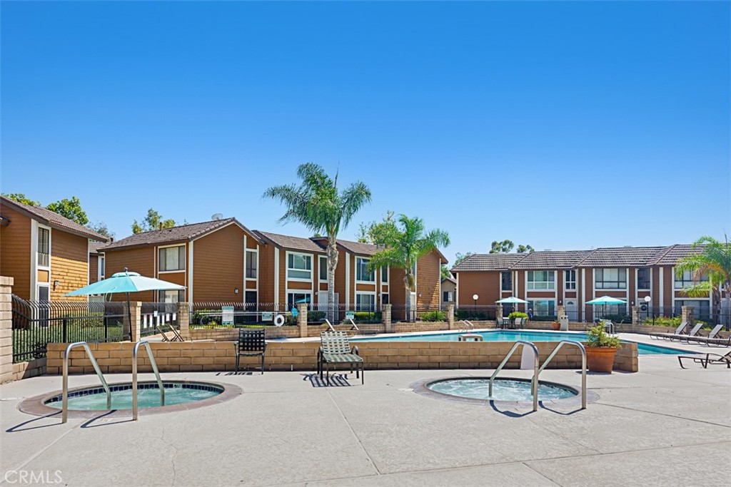 25885 Trabuco Road, Unit 203 Lake Forest, CA 92630 - Photo 26 of 43 a swimming pool with outdoor seating and yard