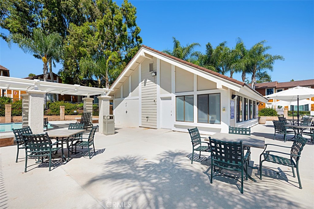 25885 Trabuco Road, Unit 203 Lake Forest, CA 92630 - Photo 28 of 43 a view of a dinning table and chairs in patio of the house