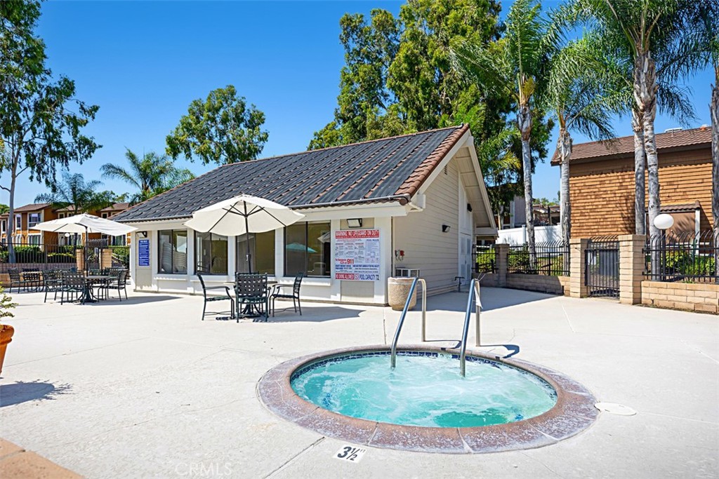 25885 Trabuco Road, Unit 203 Lake Forest, CA 92630 - Photo 29 of 43 a swimming pool with outdoor seating yard and barbeque oven