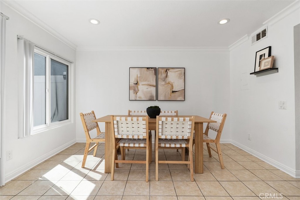 25885 Trabuco Road, Unit 203 Lake Forest, CA 92630 - Photo 3 of 43 a view of a dining room with furniture and window