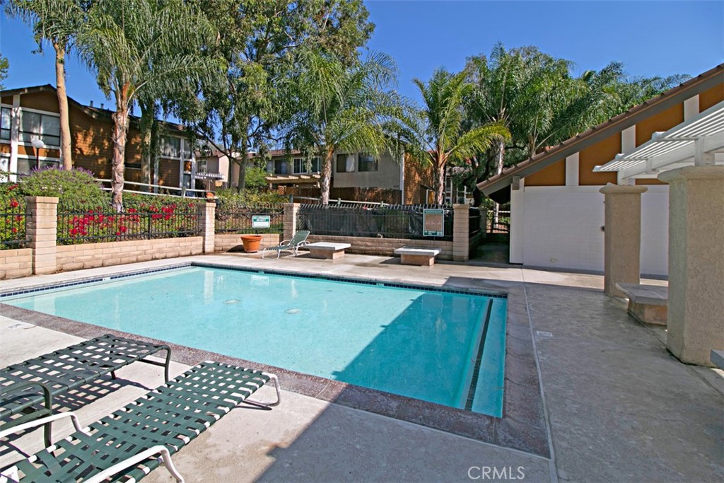 25885 Trabuco Road, Unit 203 Lake Forest, CA 92630 - Photo 40 of 43 a view of a patio with swimming pool table and chairs