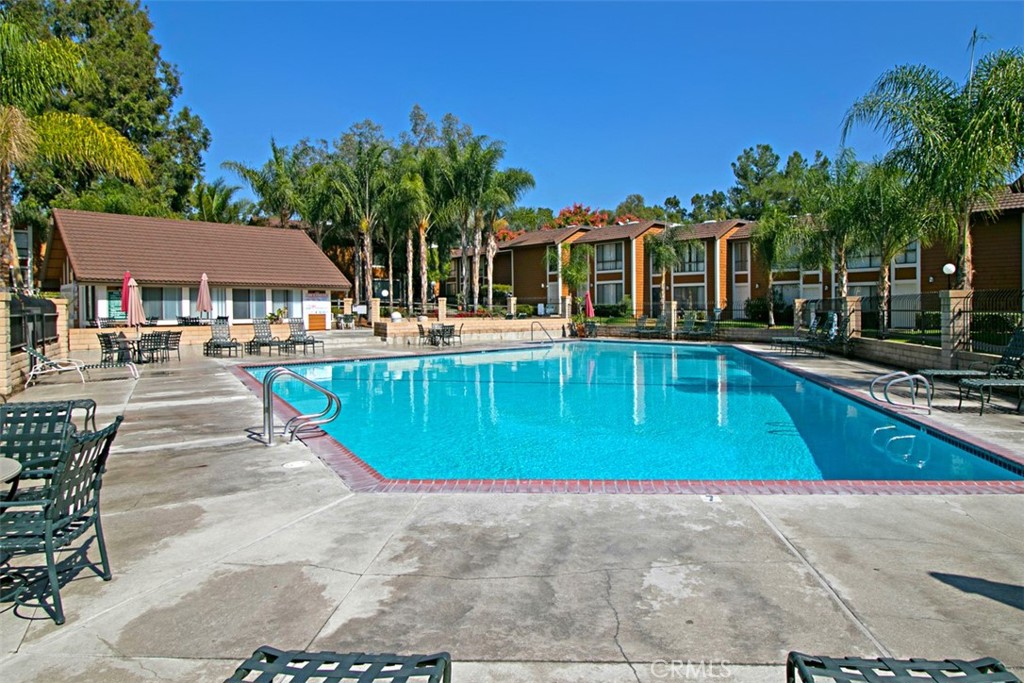 25885 Trabuco Road, Unit 203 Lake Forest, CA 92630 - Photo 41 of 43 a view of a swimming pool with a patio