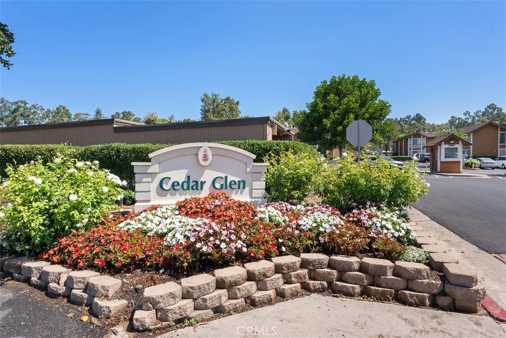 25885 Trabuco Road, Unit 203 Lake Forest, CA 92630 - Photo 42 of 43 a front view of a house with a yard and street