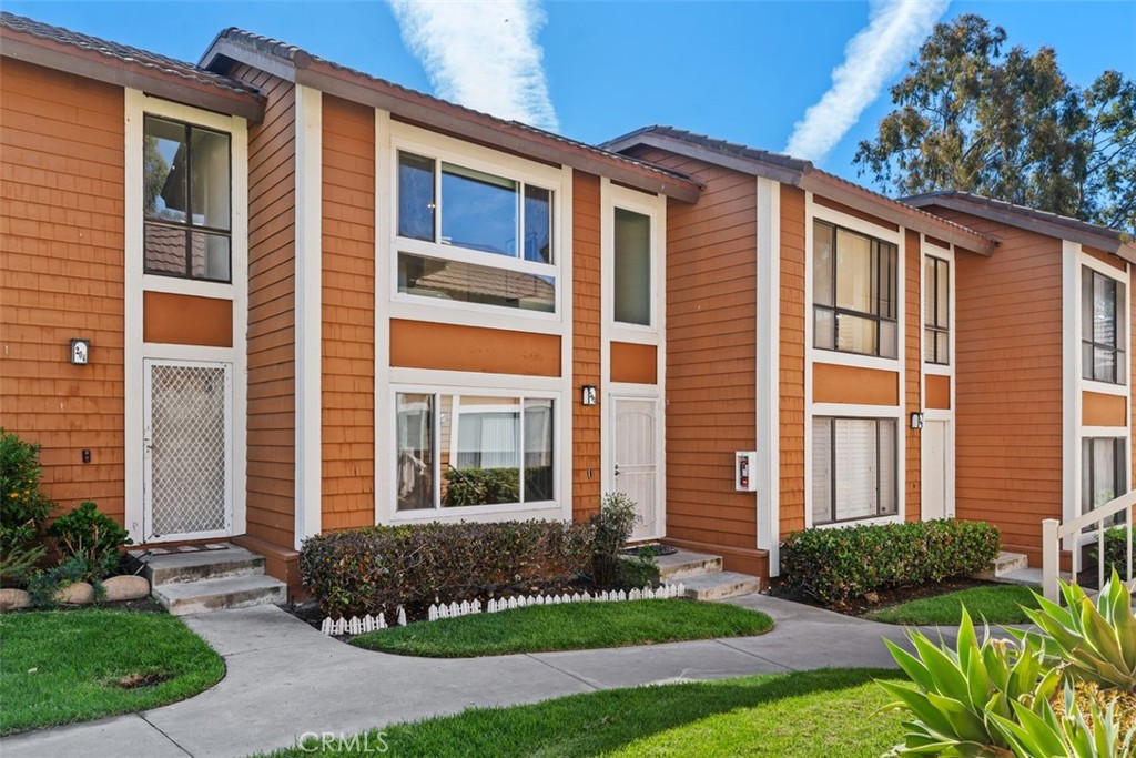 25885 Trabuco Road, Unit 203 Lake Forest, CA 92630 - Photo 43 of 43 a front view of a house with a yard