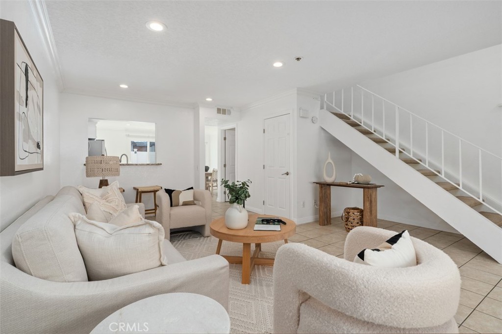 25885 Trabuco Road, Unit 203 Lake Forest, CA 92630 - Photo 7 of 43 a living room with furniture and a potted plant