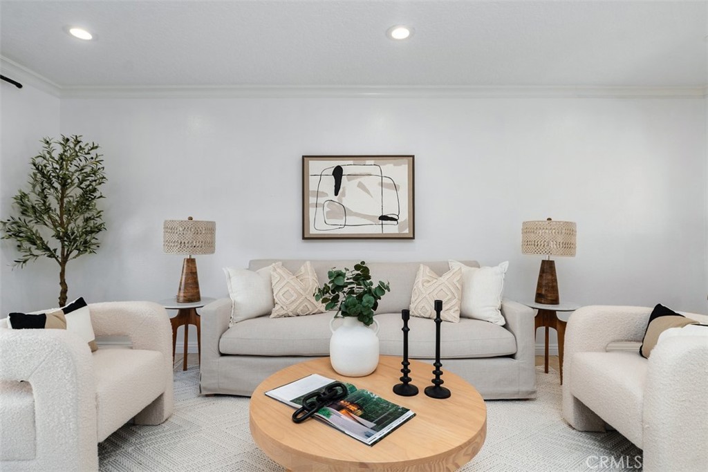 25885 Trabuco Road, Unit 203 Lake Forest, CA 92630 - Photo 9 of 43 a living room with furniture and a potted plant