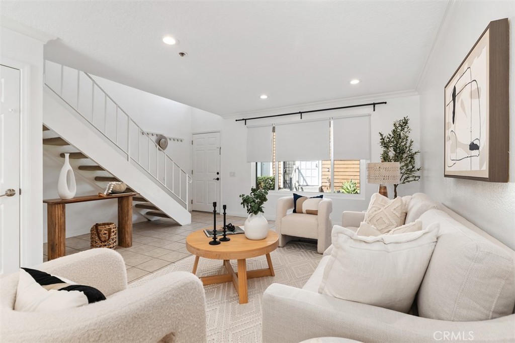 25885 Trabuco Road, Unit 203 Lake Forest, CA 92630 - Photo 10 of 43 a living room with furniture and wooden floor