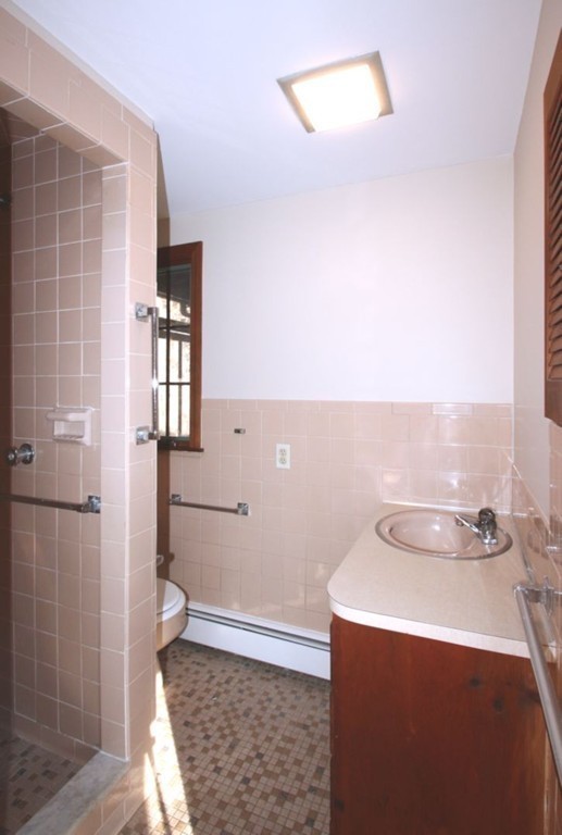 18 Parmenter Road Wayland, MA 01778 - Photo 17 of 28 a bathroom with a sink and a toilet