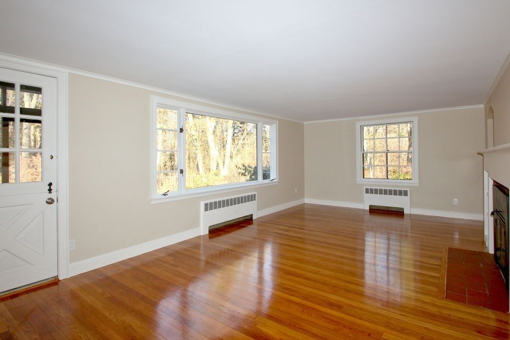 18 Parmenter Road Wayland, MA 01778 - Photo 3 of 28 wooden floor in an empty room with a window