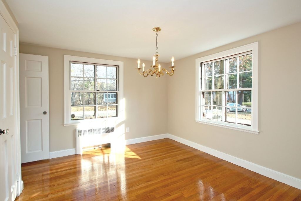 18 Parmenter Road Wayland, MA 01778 - Photo 5 of 28 a view of an empty room with wooden floor and a window