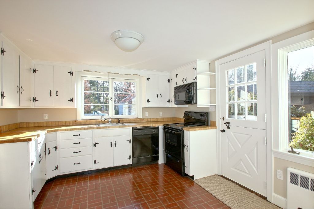 18 Parmenter Road Wayland, MA 01778 - Photo 8 of 28 a kitchen with stainless steel appliances granite countertop a stove and a sink