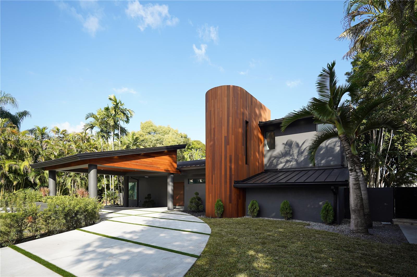 7765 Southwest 57th Terrace Miami, FL 33143 - Photo 1 of 52 a front view of a house with a yard