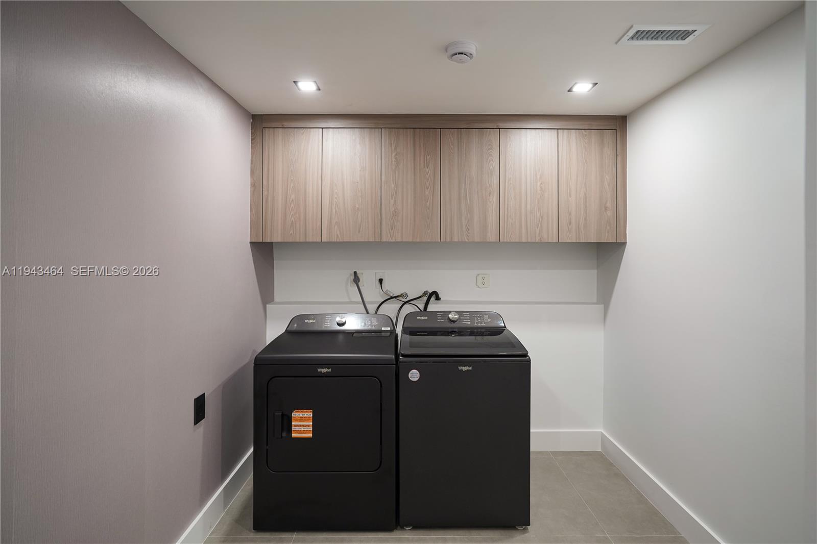 7765 Southwest 57th Terrace Miami, FL 33143 - Photo 23 of 52 a utility room with cabinets