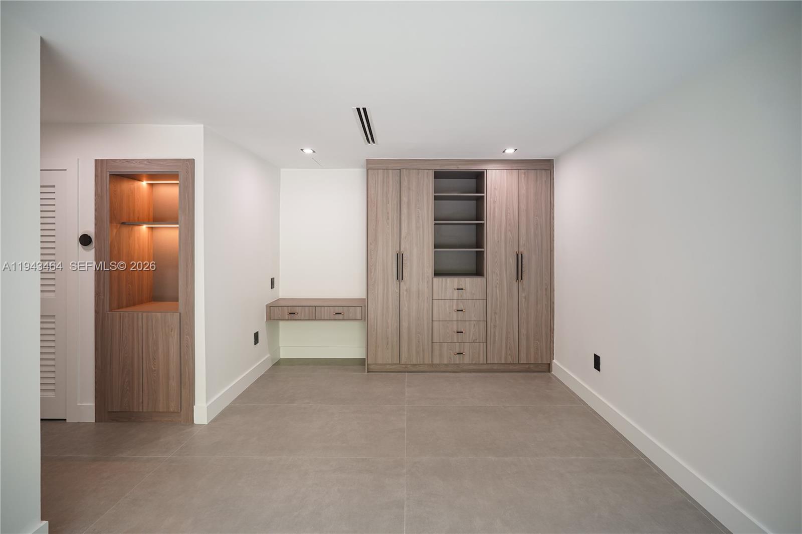 7765 Southwest 57th Terrace Miami, FL 33143 - Photo 31 of 52 an empty room with closet and a bathroom