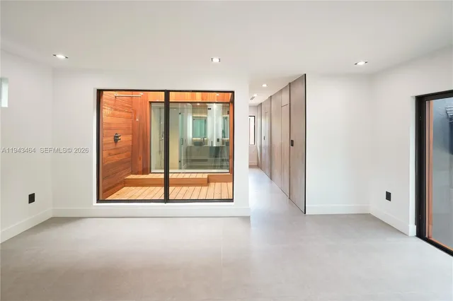 a bathroom with a mirror and a shower