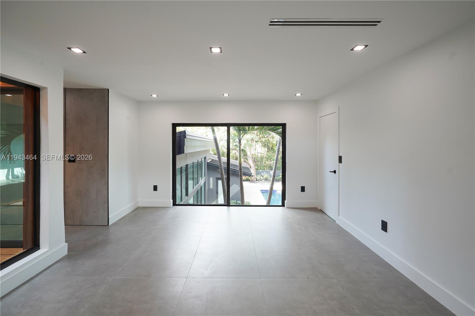 7765 Southwest 57th Terrace Miami, FL 33143 - Photo 37 of 52 a view of an empty room with a window