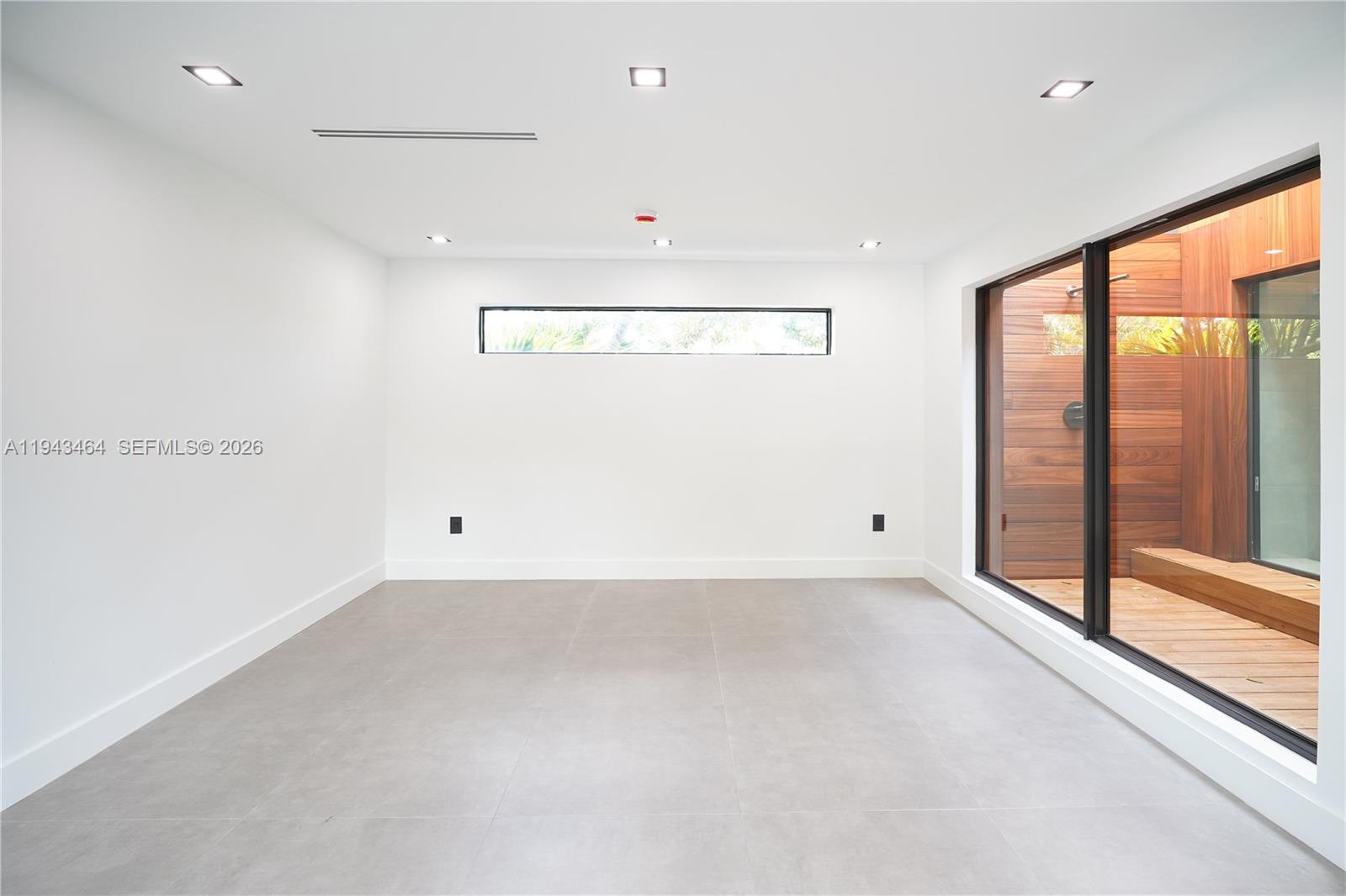 7765 Southwest 57th Terrace Miami, FL 33143 - Photo 45 of 52 a view of an empty room with a window