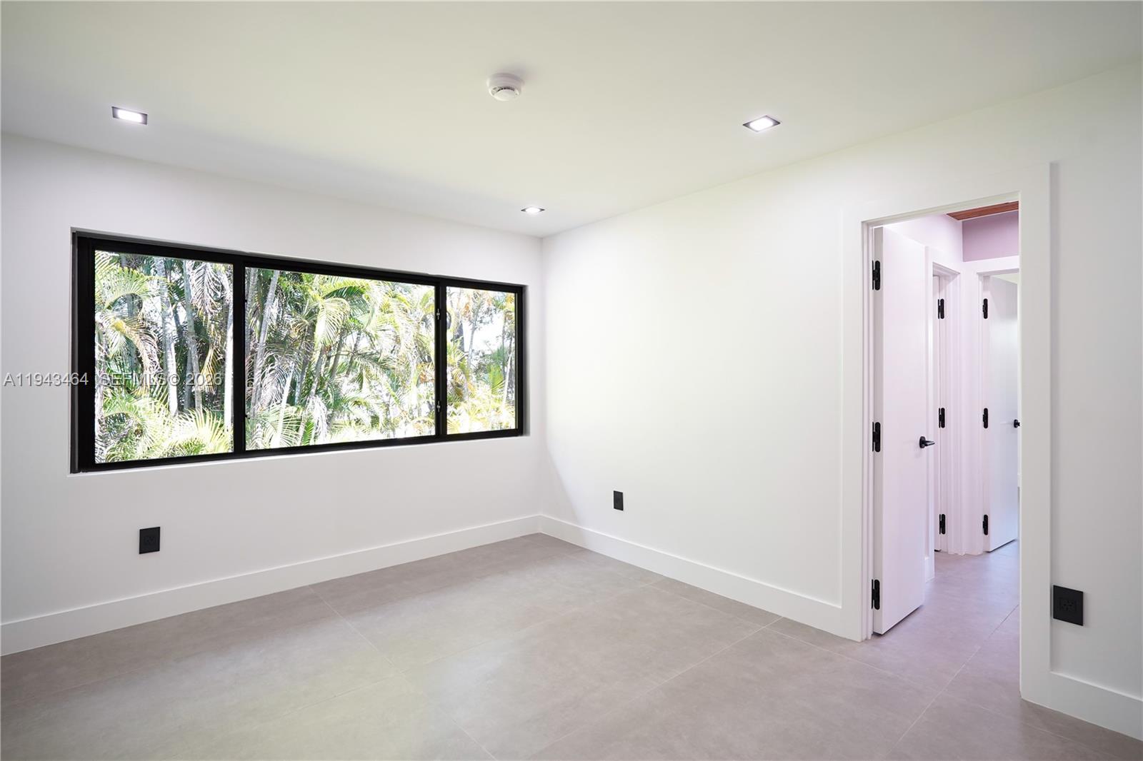 7765 Southwest 57th Terrace Miami, FL 33143 - Photo 49 of 52 an empty room with a window