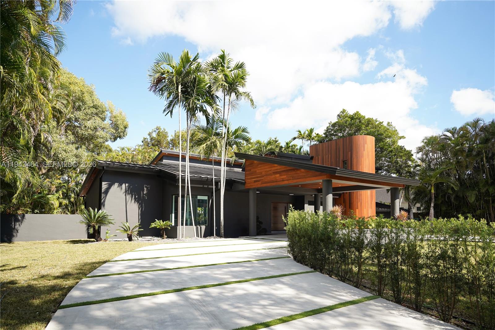 7765 Southwest 57th Terrace Miami, FL 33143 - Photo 6 of 52 a front view of a house with a garden