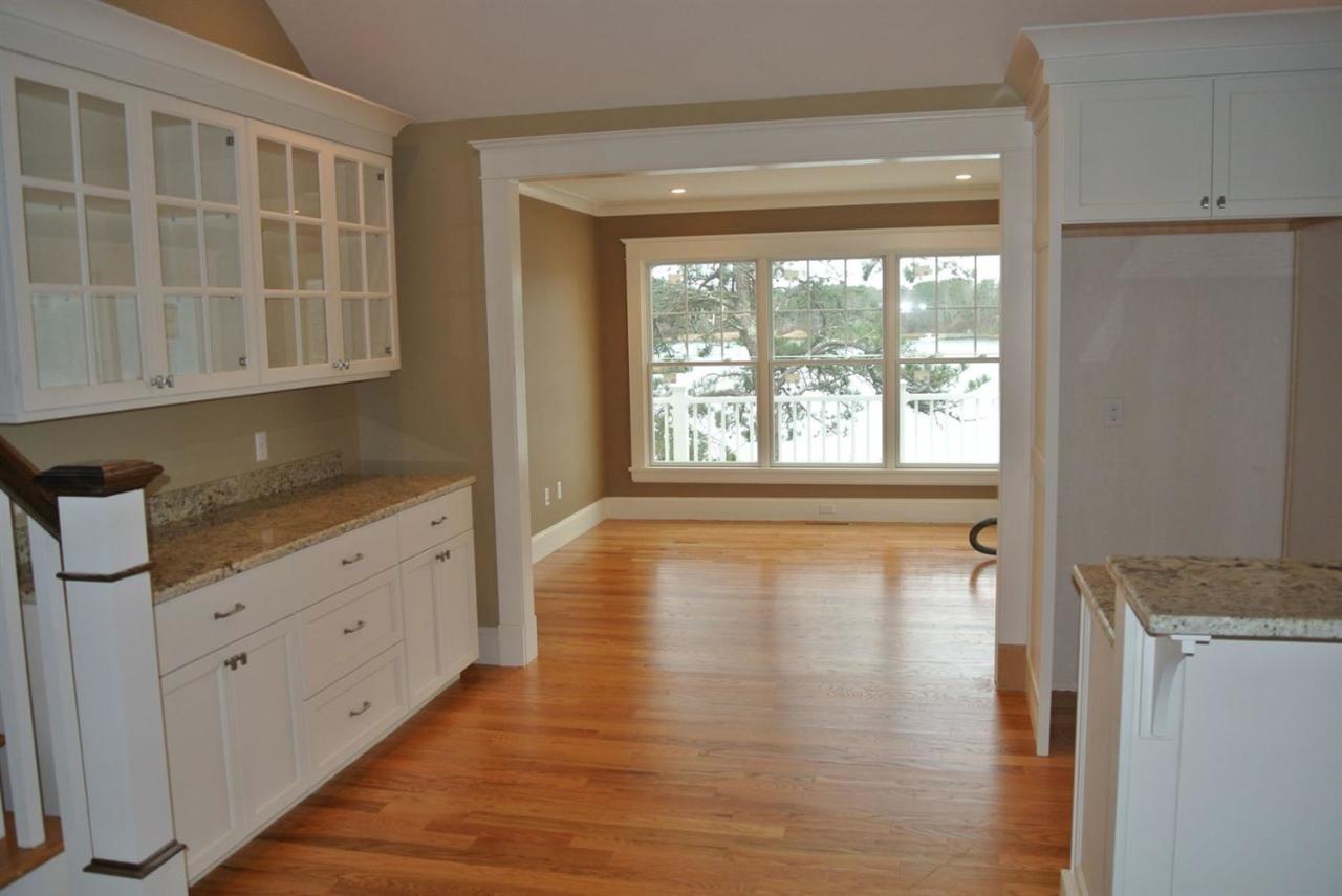 114 Summersea Road, Unit 90 Mashpee, MA 02649 - Photo 14 of 24 a view of an empty room with wooden floor and a window