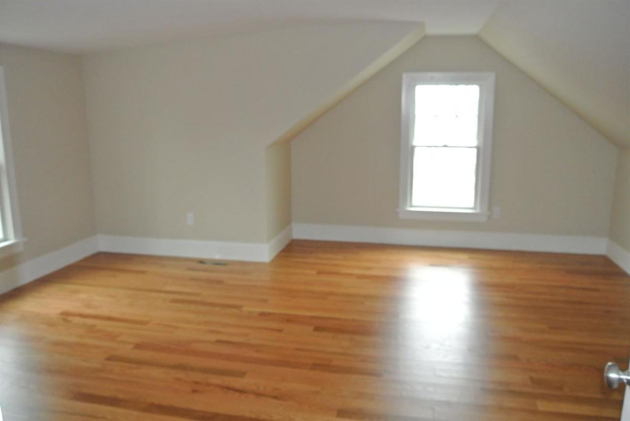 114 Summersea Road, Unit 90 Mashpee, MA 02649 - Photo 15 of 24 a view of empty room with wooden floor and fan