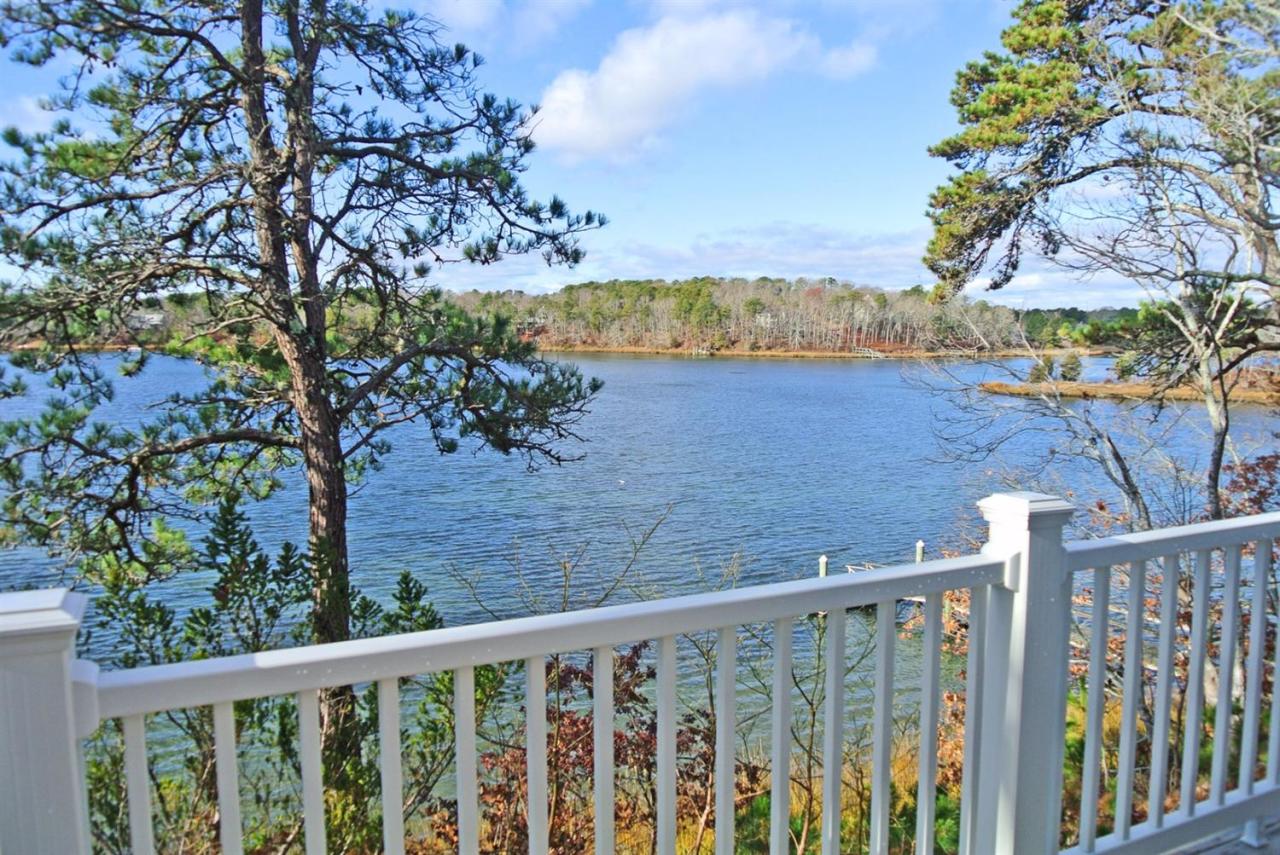 114 Summersea Road, Unit 90 Mashpee, MA 02649 - Photo 24 of 24 a view of a balcony with a tree