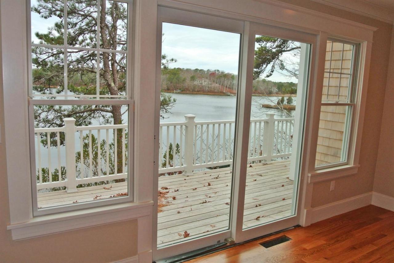 114 Summersea Road, Unit 90 Mashpee, MA 02649 - Photo 8 of 24 en empty room with wooden floor and fan