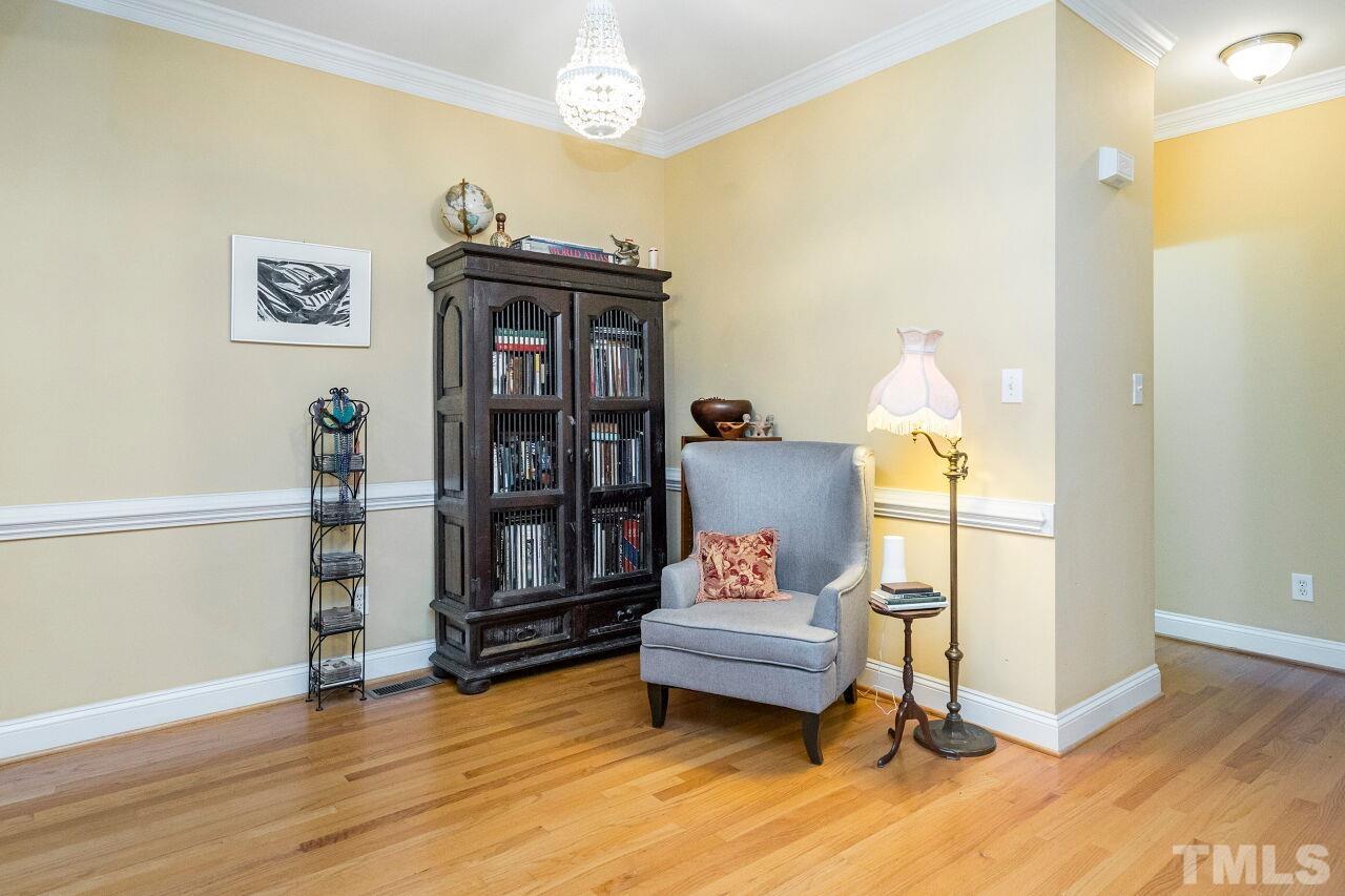 2521 Kilgore Avenue Raleigh, NC 27607 - Photo 8 of 30 a living room with furniture and a wooden floor