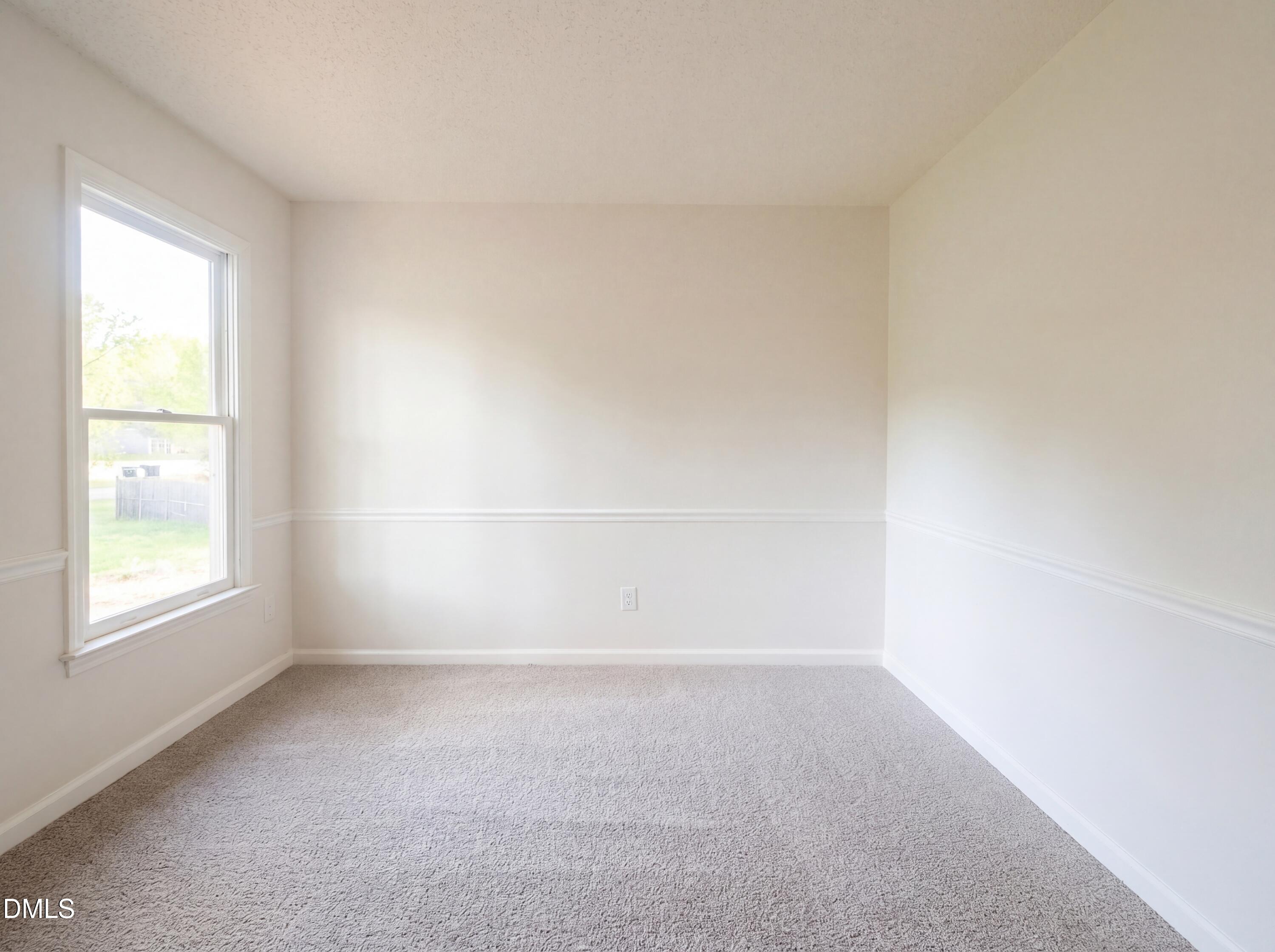 8988 Stamford Club Court Rural Hall, NC 27045 - Photo 11 of 22 an empty room with a window